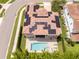 Aerial view of the home with solar panels, a private pool, and a relaxing lounge area at 682 Canopy Estates Dr, Winter Garden, FL 34787