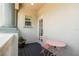 Private balcony featuring a pink bistro table set, perfect for enjoying outdoor relaxation at 682 Canopy Estates Dr, Winter Garden, FL 34787