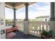 Charming balcony with decorative balustrade and columns, offering a cozy outdoor space at 682 Canopy Estates Dr, Winter Garden, FL 34787