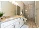 Modern bathroom with double sink, granite countertops, and walk-in shower, all illuminated by recessed lighting at 682 Canopy Estates Dr, Winter Garden, FL 34787