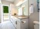 Bright bathroom with double vanity, granite countertops and direct access to outdoor space at 682 Canopy Estates Dr, Winter Garden, FL 34787