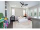 Bright bedroom with three windows and neutral walls at 682 Canopy Estates Dr, Winter Garden, FL 34787