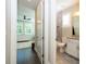 Hallway view of bedroom and bathroom showing hardwood flooring and natural light at 682 Canopy Estates Dr, Winter Garden, FL 34787