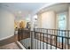 Upper hallway featuring detailed railings, trim, and multiple views into other rooms at 682 Canopy Estates Dr, Winter Garden, FL 34787