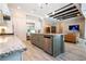 Modern kitchen featuring stainless steel appliances, a large island, and an open layout to the living area at 682 Canopy Estates Dr, Winter Garden, FL 34787