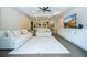 Bright living room with neutral tones, ceiling fan, white sofas, and built-in shelving offers comfortable living at 682 Canopy Estates Dr, Winter Garden, FL 34787