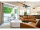 Open-concept living space with access to the outdoor pool area, connecting the kitchen, dining, and living rooms at 682 Canopy Estates Dr, Winter Garden, FL 34787