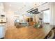 Open floorplan showing kitchen, dining, and living area with modern finishes and abundant natural light at 682 Canopy Estates Dr, Winter Garden, FL 34787