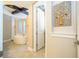This main bathroom features a soaking tub, travertine floors, custom cabinetry and a walk-in shower at 682 Canopy Estates Dr, Winter Garden, FL 34787