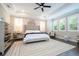 The main bedroom boasts natural light, plantation shutters, a ceiling fan, and elegant neutral decor at 682 Canopy Estates Dr, Winter Garden, FL 34787