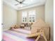 Inviting playroom with soft flooring, natural light, and fun play tent at 682 Canopy Estates Dr, Winter Garden, FL 34787