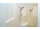 Elegant shower with dual showerheads and white tiling at 682 Canopy Estates Dr, Winter Garden, FL 34787