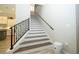 Bright stairway with detailed wood and white stairs, leading to the upper level of the home at 682 Canopy Estates Dr, Winter Garden, FL 34787