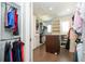 Spacious walk-in closet with ample storage and custom organization at 682 Canopy Estates Dr, Winter Garden, FL 34787