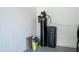 Garage view with water softener, salt, and holding tank for the home's water system at 682 Canopy Estates Dr, Winter Garden, FL 34787