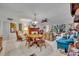 Spacious living room featuring a dining area, fireplace, and large windows at 700 Melrose Ave # C22, Winter Park, FL 32789