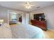 This bedroom features hardwood floors, ceiling fan, and a closet with mirrored sliding doors at 720 Meadow St, Sanford, FL 32773