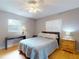 Cozy bedroom featuring light wood floors, and neutral colored walls at 720 Meadow St, Sanford, FL 32773