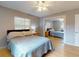 Bedroom with natural light, a ceiling fan and light colored wood floors at 720 Meadow St, Sanford, FL 32773