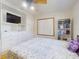 Bedroom featuring hardwood floors, and built in closet at 720 Meadow St, Sanford, FL 32773