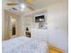 Bright bedroom features custom built-in cabinetry, work space, and ceiling fan at 720 Meadow St, Sanford, FL 32773