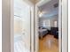 Hallway leading to the bathroom with tiled walls and flooring, and the bedroom at 720 Meadow St, Sanford, FL 32773
