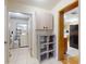 Hallway view of the laundry room with washer and dryer, and the kitchen at 720 Meadow St, Sanford, FL 32773