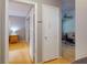 Hallway with wood floors leading to bedroom and living room at 720 Meadow St, Sanford, FL 32773