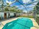 A screened pool with an adjacent patio and fenced yard offers a great outdoor living space at 720 Meadow St, Sanford, FL 32773