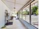 Inviting screened-in porch with wicker seating and view of the fenced yard at 720 Meadow St, Sanford, FL 32773