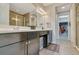 Bathroom featuring double vanity with dark cabinets, walk-in closet, and tiled shower at 813 Greybull Run, Lake Mary, FL 32746