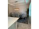 Modern dining room featuring a textured accent wall, elegant lighting, and seating for four at 813 Greybull Run, Lake Mary, FL 32746