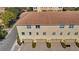 Three-story townhome featuring a three-car garage and well-maintained landscaping along the sidewalk at 813 Greybull Run, Lake Mary, FL 32746