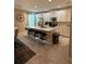 Bright, modern kitchen featuring white cabinets, stainless steel appliances, and a spacious center island with bar seating at 813 Greybull Run, Lake Mary, FL 32746