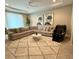 Spacious living room featuring a plush sectional sofa, stylish rug, and contemporary decor at 813 Greybull Run, Lake Mary, FL 32746