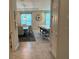 Open-concept living space with dining area, kitchen island, and contemporary furnishings at 813 Greybull Run, Lake Mary, FL 32746