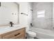 Stylish bathroom featuring a modern vanity, tiled shower, and sleek fixtures at 817 E Mcdonald Ave, Eustis, FL 32726