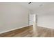 Bedroom with wood-look floors, doorway, and ceiling fan at 817 E Mcdonald Ave, Eustis, FL 32726