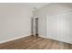 Bedroom featuring wood-look floors, a double closet, and doorway at 817 E Mcdonald Ave, Eustis, FL 32726