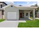 Charming home with a one-car garage, modern exterior, and a neatly maintained front yard at 817 E Mcdonald Ave, Eustis, FL 32726