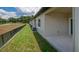 Backyard of a neutral house, featuring grass at 8584 Magnificent Ln, Groveland, FL 34736
