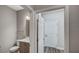 Powder room featuring modern fixtures, vanity with storage, and neutral color palette at 8584 Magnificent Ln, Groveland, FL 34736