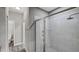 Bathroom with glass-enclosed shower and toilet room at 8584 Magnificent Ln, Groveland, FL 34736