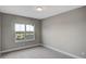 Bedroom featuring carpeted floor and a window looking outside at 8584 Magnificent Ln, Groveland, FL 34736