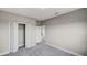 Neutral bedroom with carpet, closet, and white trim at 8584 Magnificent Ln, Groveland, FL 34736