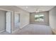 Bedroom featuring carpeted floor and window looking outside at 8584 Magnificent Ln, Groveland, FL 34736