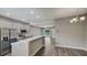 Bright kitchen featuring stainless steel appliances, quartz countertops, and access to the dining area at 8584 Magnificent Ln, Groveland, FL 34736