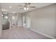 Spacious living room featuring carpet and multiple entryways at 8584 Magnificent Ln, Groveland, FL 34736