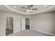 Spacious bedroom with carpeted floors and ensuite bath at 8584 Magnificent Ln, Groveland, FL 34736