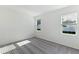 Comfortable bedroom featuring neutral walls, soft carpeting, and windows for natural light at 9112 Wildlight Trl, Wildwood, FL 34785